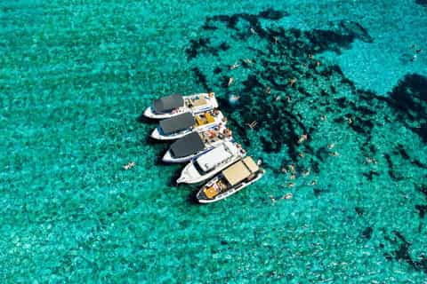 Small speedboat on open water near islands